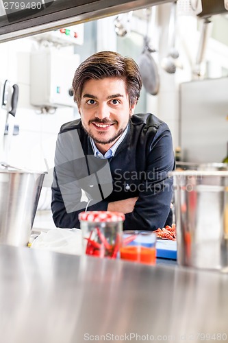 Image of Chef cooking a vegetables stir fry over a hob