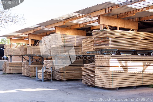 Image of Wooden panels stored inside a warehouse