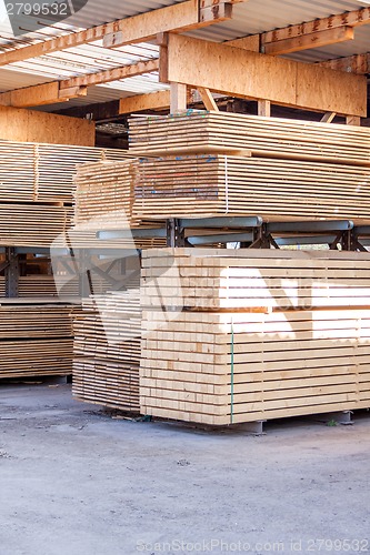 Image of Wooden panels stored inside a warehouse