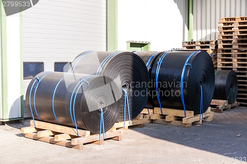 Image of Rolls of black industrial plastic