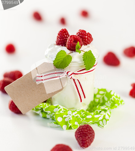 Image of Raspberries and yoghurt or clotted cream