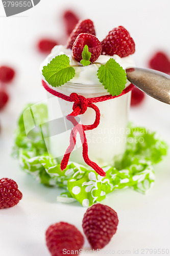 Image of Raspberries and yoghurt or clotted cream