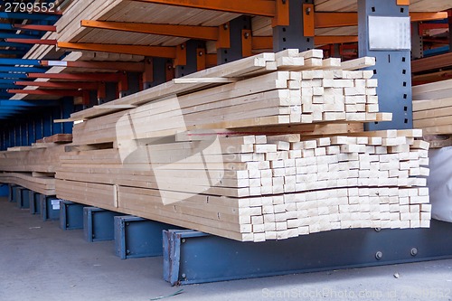 Image of Wooden panels stored inside a warehouse