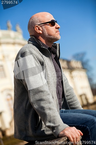 Image of Stylish man in sunglasses enjoying the sun