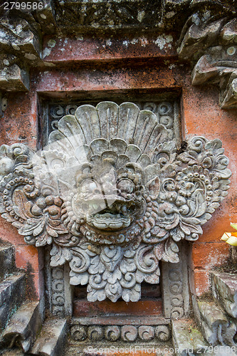 Image of Ornate column in formal Balinese garden