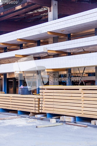 Image of Wooden panels stored inside a warehouse