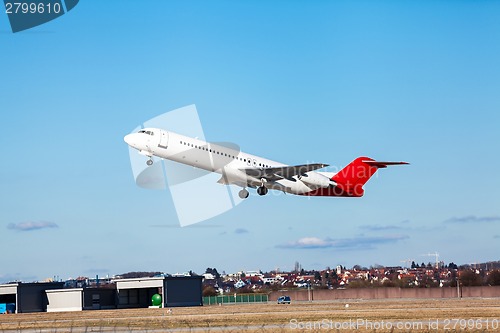 Image of Passenger airliner taking off at an airport