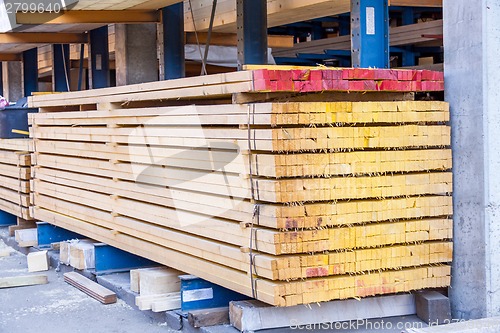 Image of Wooden panels stored inside a warehouse