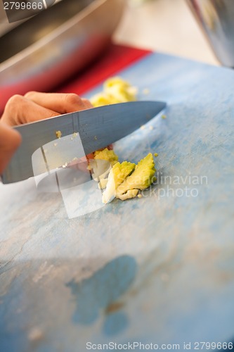 Image of Chef chopping salad ingredients