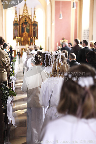 Image of Communion children move into church