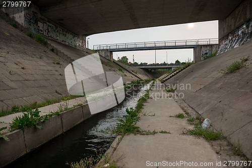 Image of Sewage canal outdoors with water