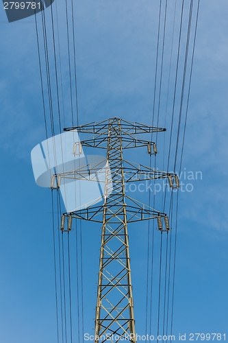 Image of Large electric pylon with blue sky