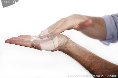 Image of Man uses hand cream