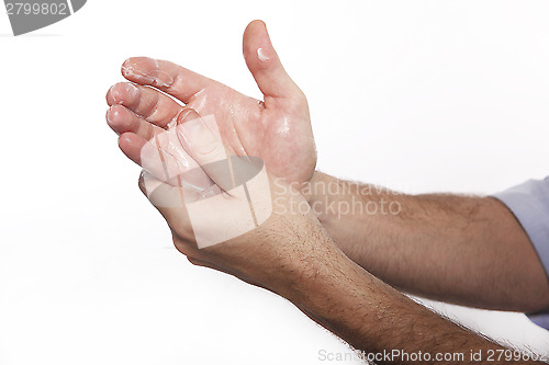 Image of Man uses hand cream