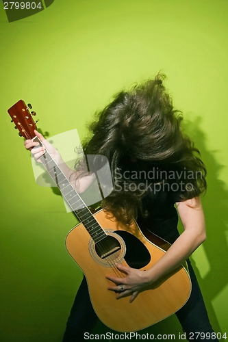 Image of Rock woman shaking hair