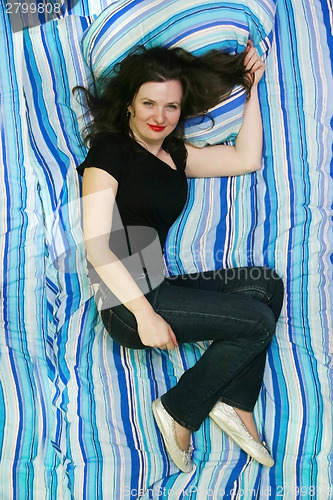Image of Woman lying on bed