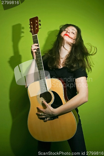 Image of Rock woman playing guitar