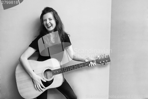 Image of Woman with guitar