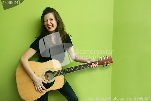 Image of Young woman with guitar