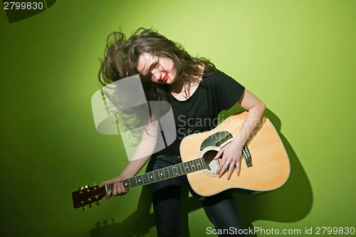 Image of Woman and guitar