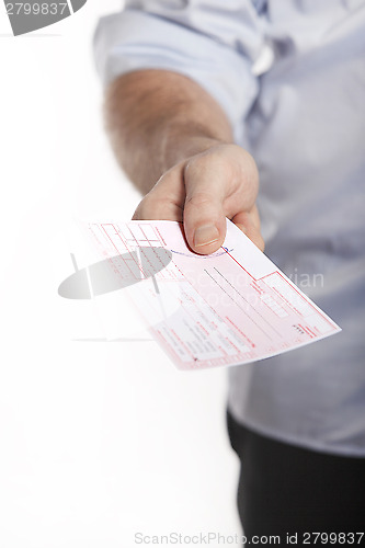 Image of Man holds doctor prescription in hand