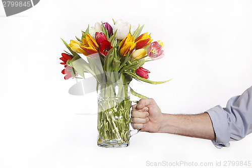 Image of A hand full of colorful tulips