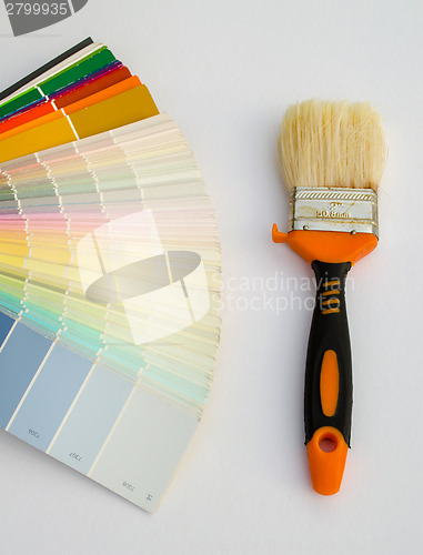 Image of color palette chart and paint brush on white 