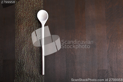 Image of Wooden spoon on dark background