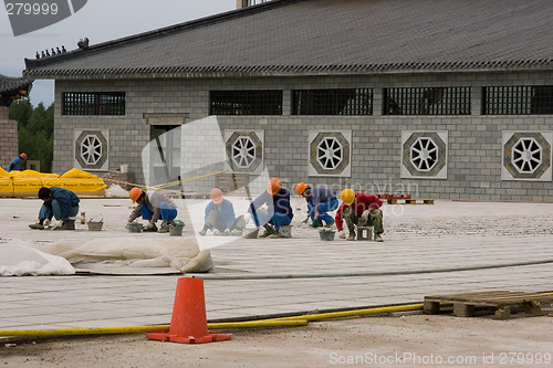 Image of Chinese workers building Dragons Gate