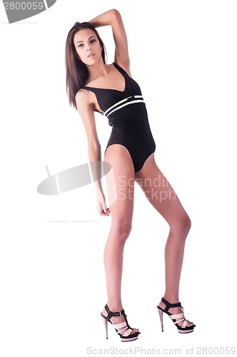 Image of Beautiful young woman in gym suit