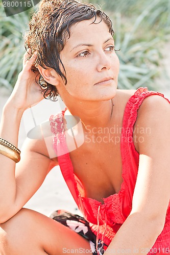 Image of brunet woman in red