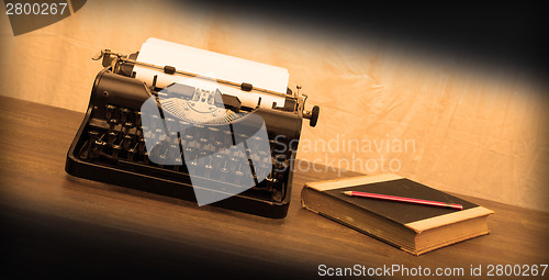 Image of Vintage typewriter and old books