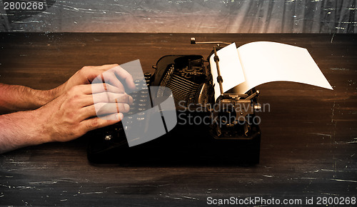 Image of Writer or reporter behind the typewriter