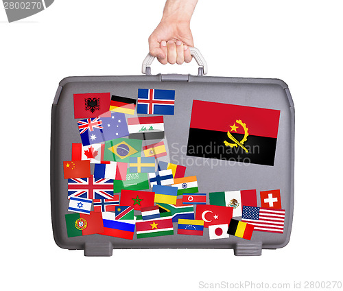 Image of Used plastic suitcase with stickers