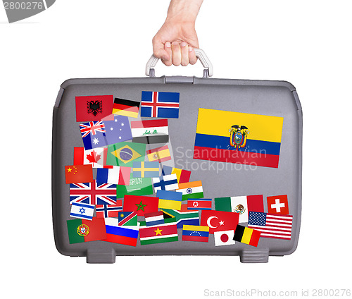 Image of Used plastic suitcase with stickers