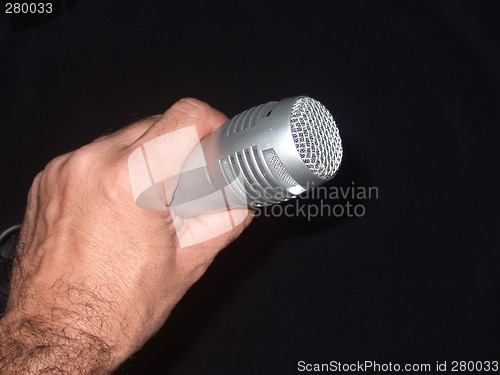 Image of Holding a microphone