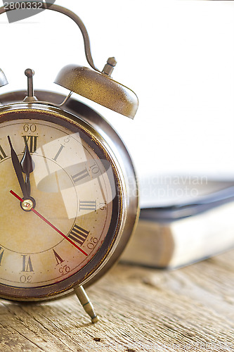 Image of Clock and Bible on wood