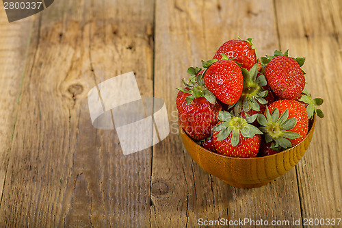 Image of Fresh strawberries in wood bowl 