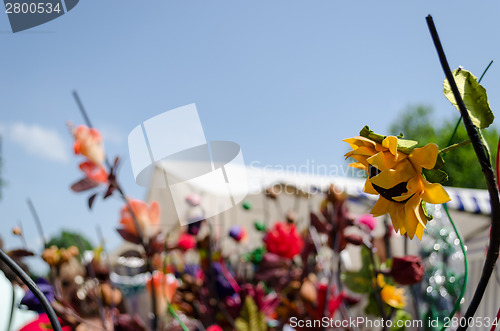Image of unreal paper yellow sunflower on fair background 