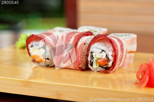 Image of Sushi roll with bacon