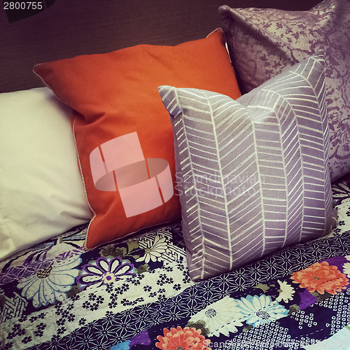 Image of Colorful pillows on a bed