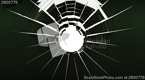 Image of Hole and Pieces of shattered glass isolated on white