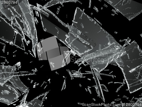 Image of Many pieces of shattered glass over black