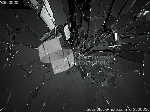 Image of Many pieces of shattered glass over black