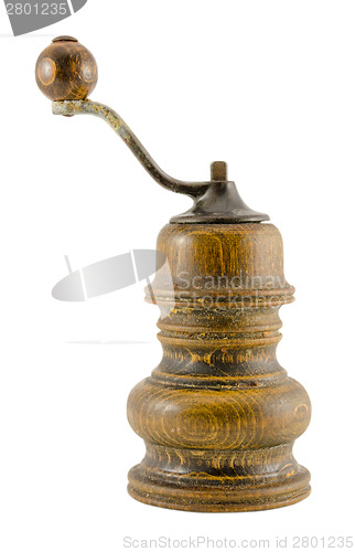 Image of antique wooden pepper grinder isoalted on white  