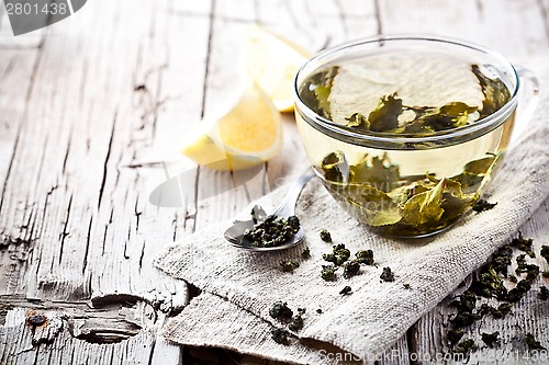 Image of cup of green tea and lemon