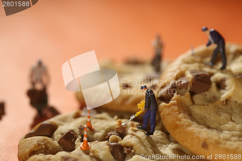 Image of  Plastic People Working on Chocolate Chip Cookies