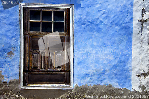 Image of  brown wood   window in a blue wall arrecife 