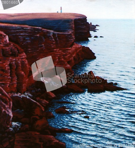 Image of red coast with lighthouse