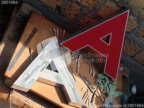 Image of three-dementional letter "A" lighted